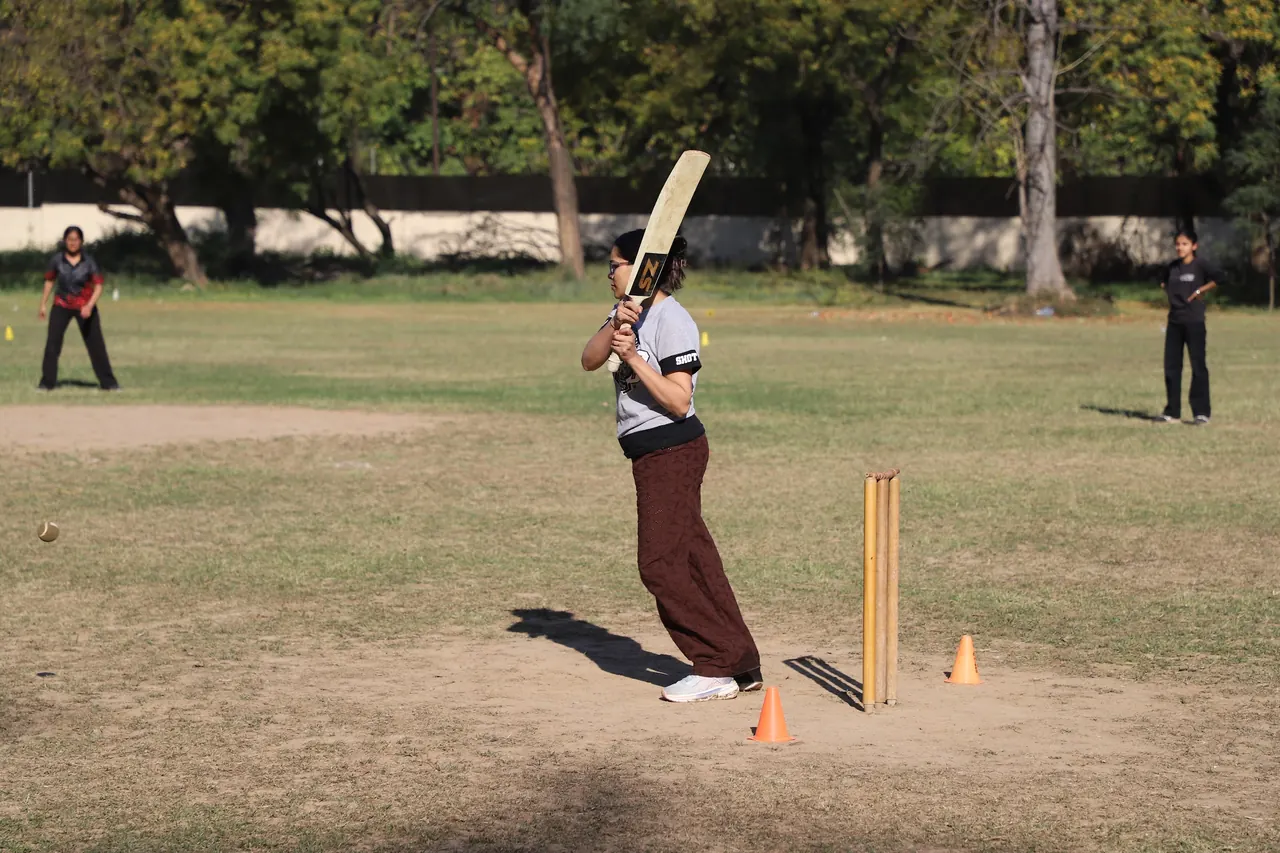 A batter takes guard in a cricket match