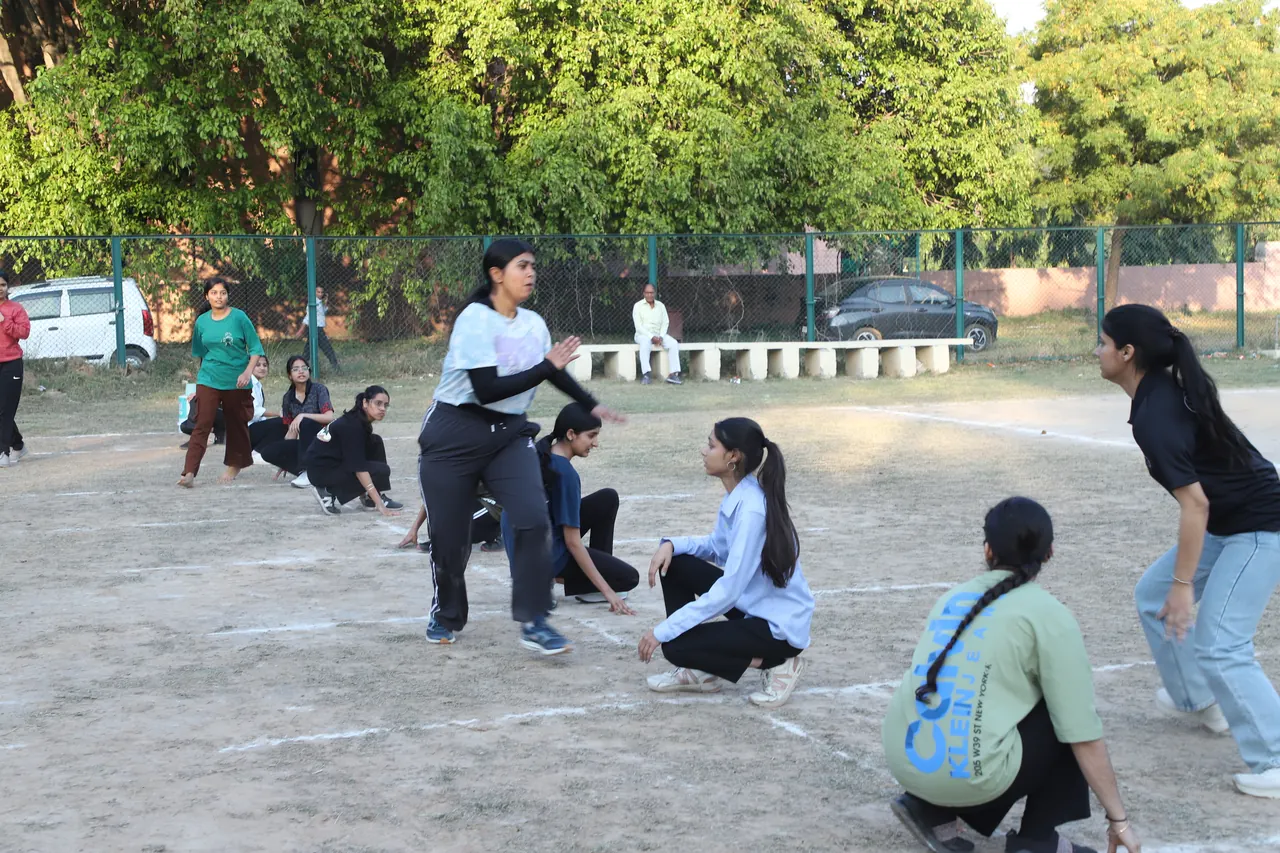 Kho kho players in motion on the outdoor court