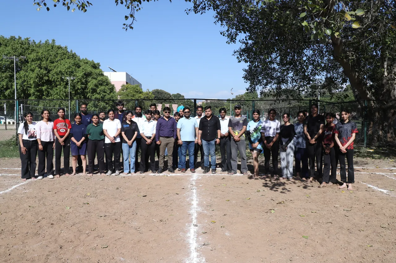Participants line up on the mud court