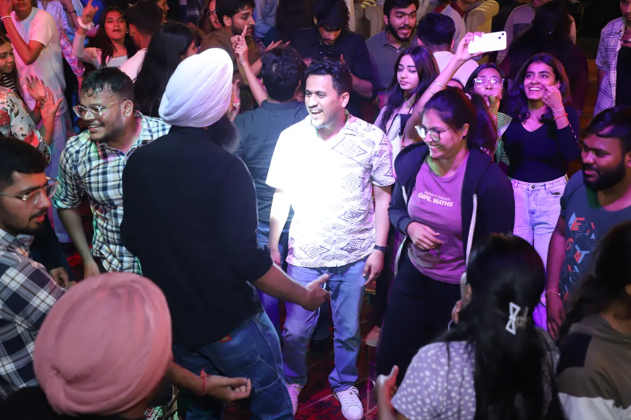 Participants dance in the crowd