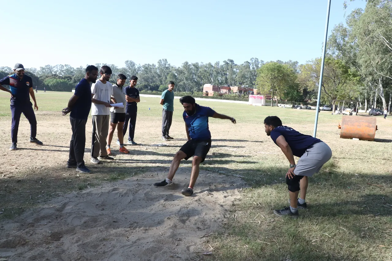 Athletes compete in a field event