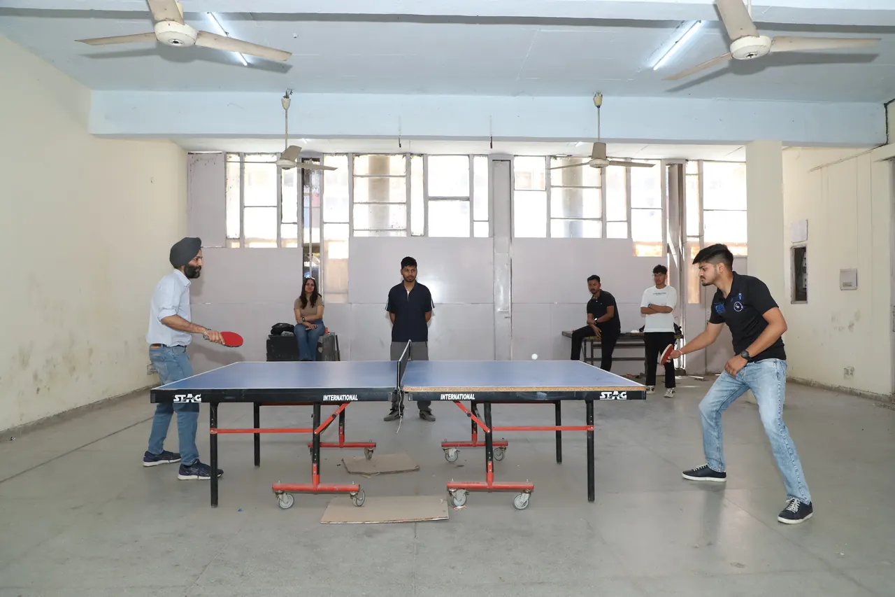 Two players in a table tennis rally