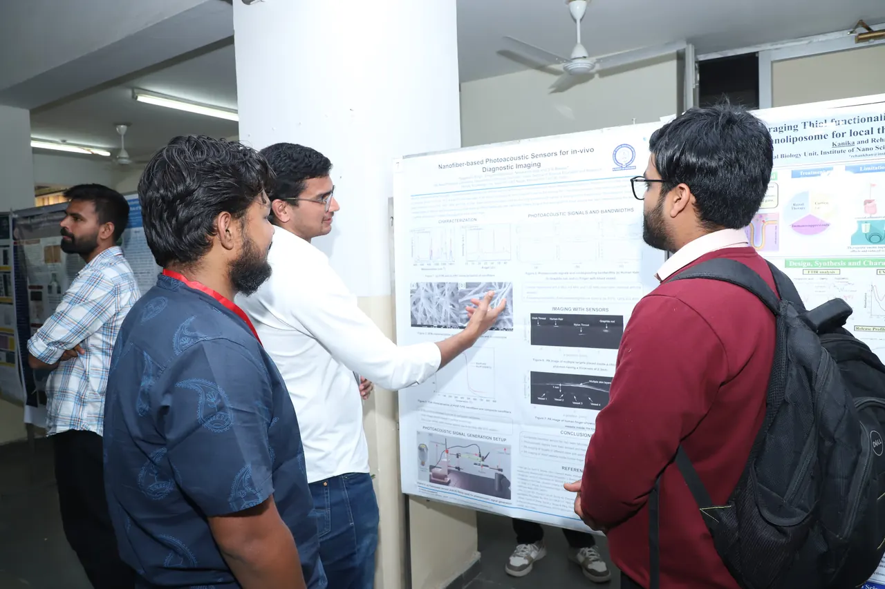 Visitors discuss a poster displayed in the corridor